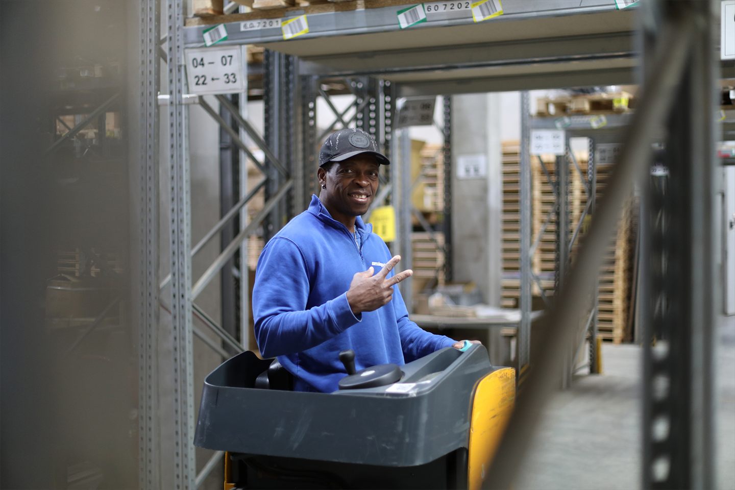 An employee on a warehouse truck